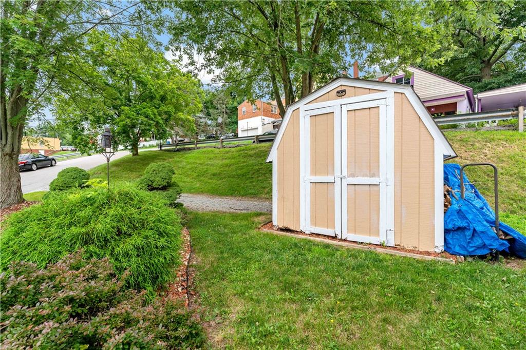 3181 Mellott Road Pittsburgh, PA 15227 - Photo 34 of 34 a front view of a house with garden
