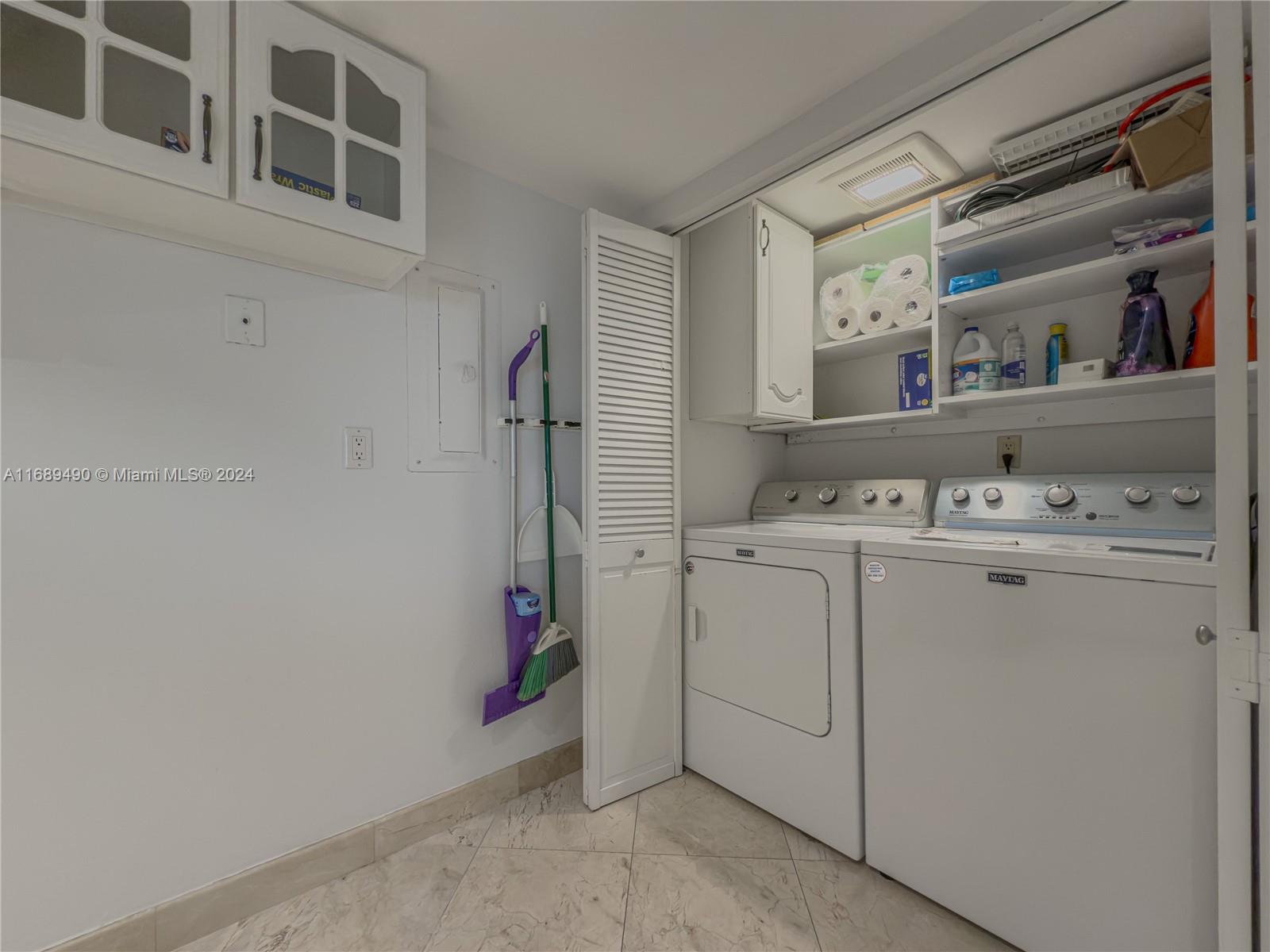 520 Brickell Key Drive, Unit A705 Miami, FL 33131 - Photo 15 of 66 a utility room with dryer and washer