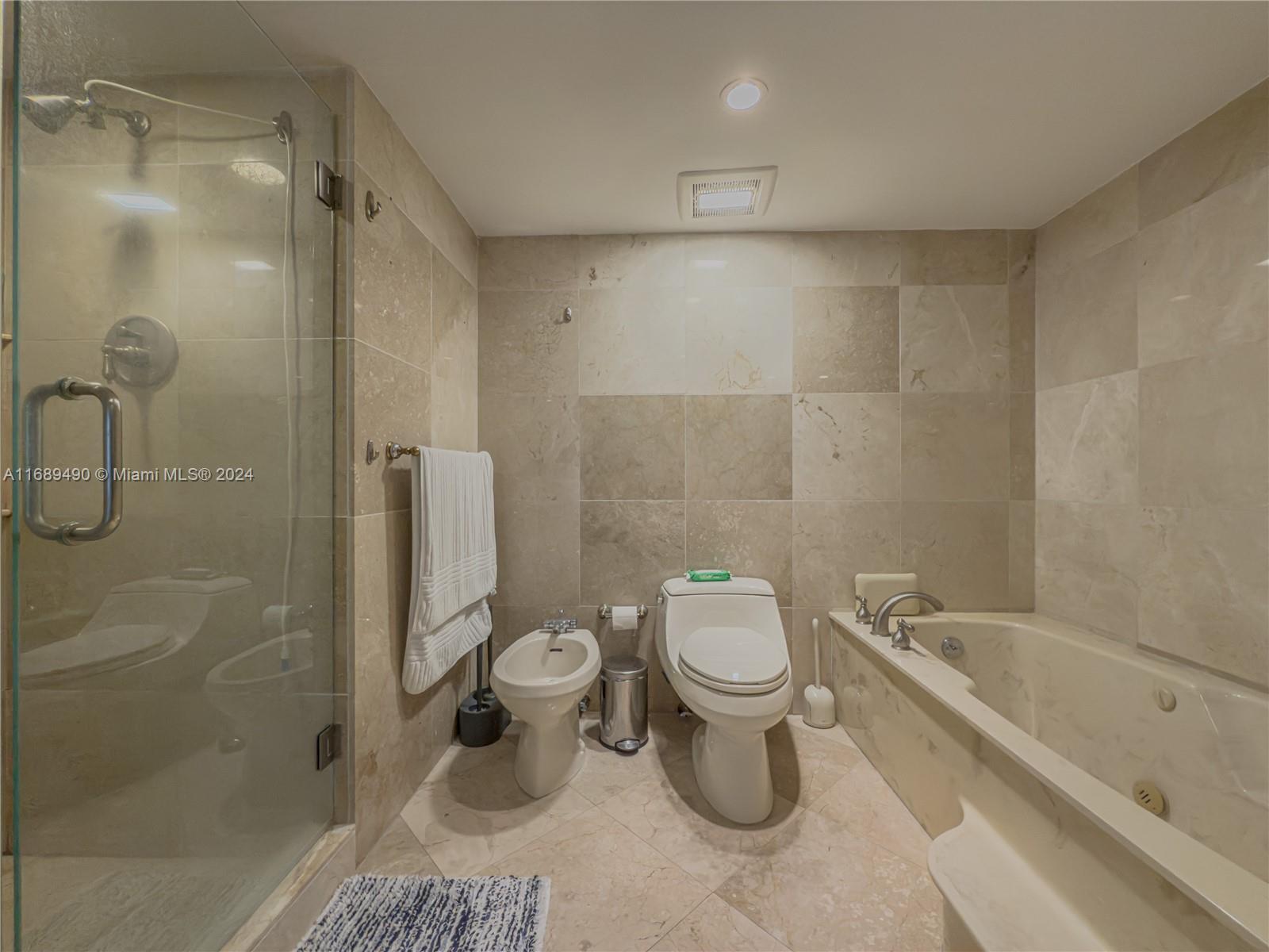 520 Brickell Key Drive, Unit A705 Miami, FL 33131 - Photo 29 of 66 a bathroom with a toilet and a shower