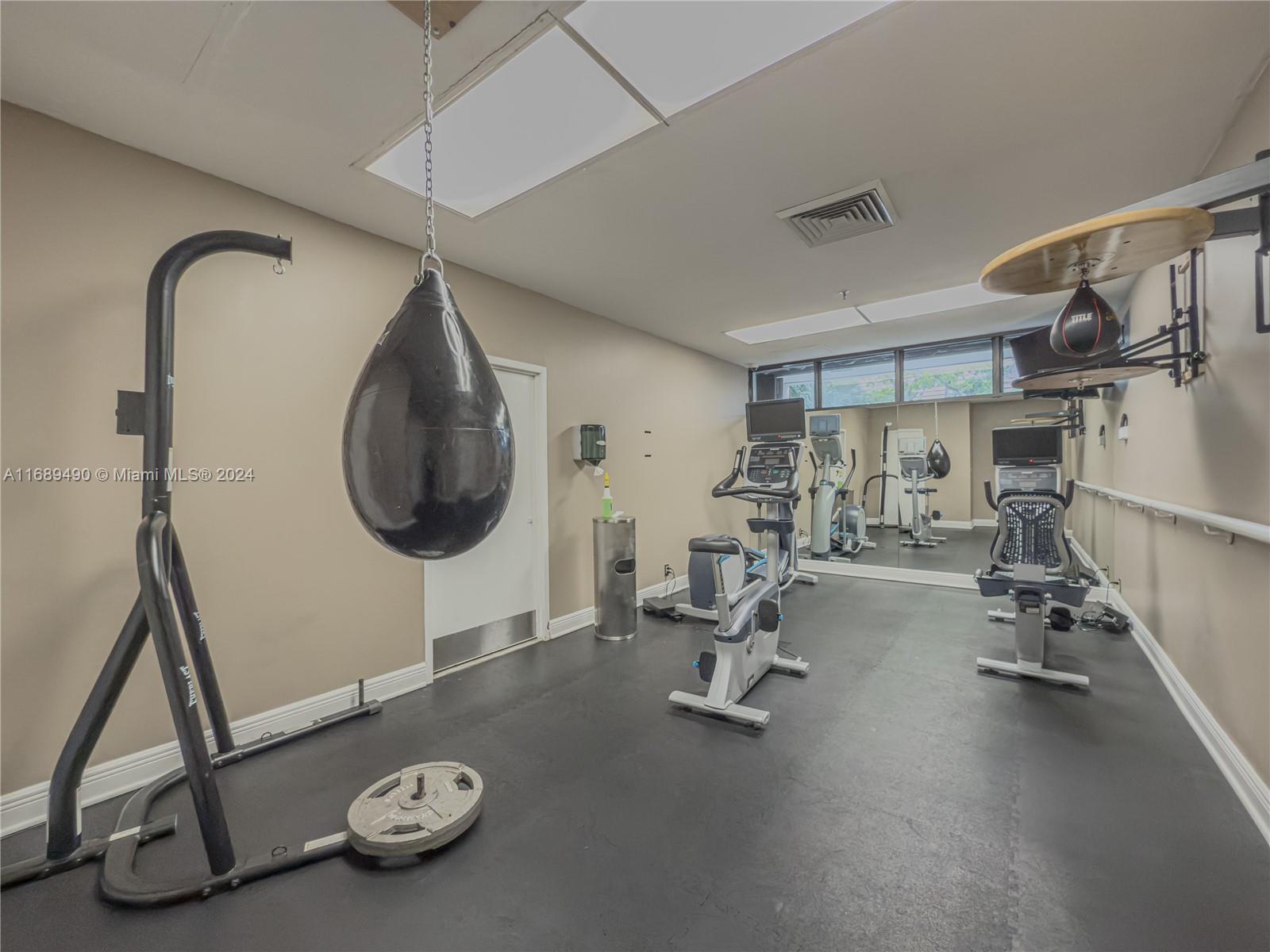 520 Brickell Key Drive, Unit A705 Miami, FL 33131 - Photo 41 of 66 a room with gym equipment
