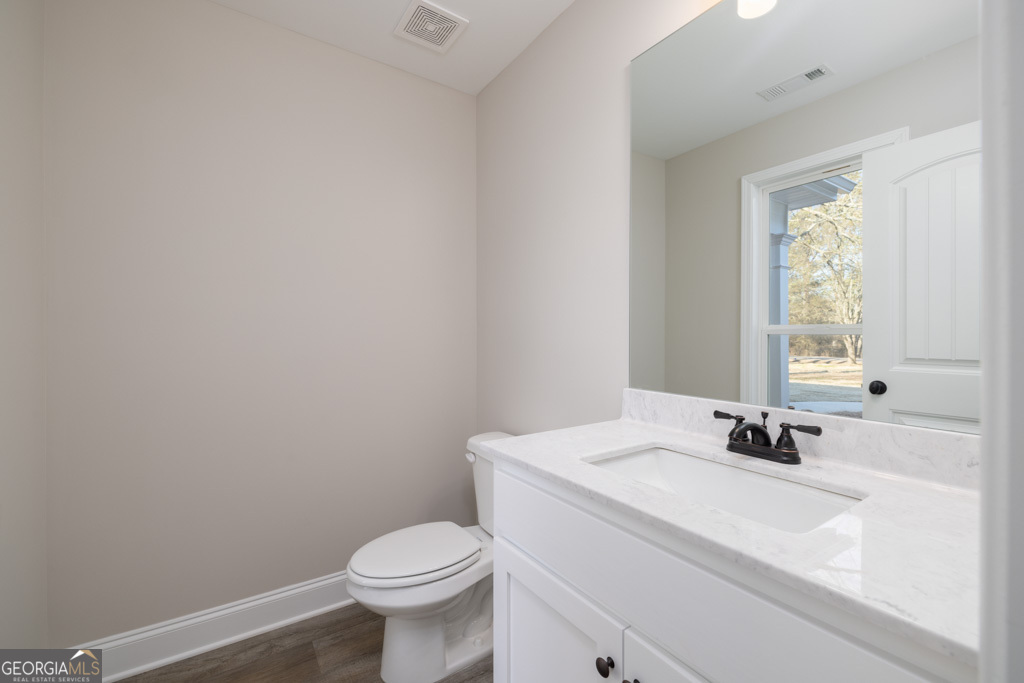 300 Grady Brock Road, Unit 20 Martin, GA 30557 - Photo 14 of 26 a bathroom with a sink toilet and a window