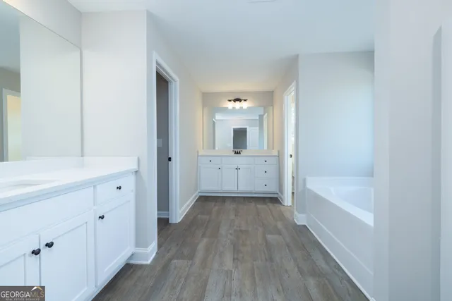 a bathroom with a bathtub and shower