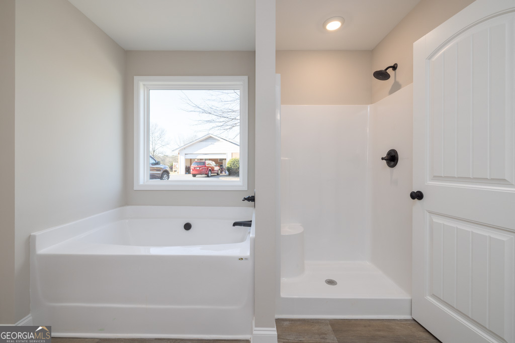 300 Grady Brock Road, Unit 20 Martin, GA 30557 - Photo 22 of 26 a bathroom with a bathtub and shower