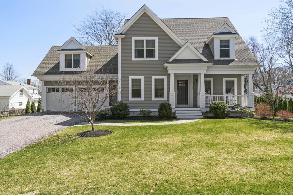 38 Smith Place Cohasset, MA 02025 - Photo 1 of 28 a front view of a house with a yard garage and outdoor seating