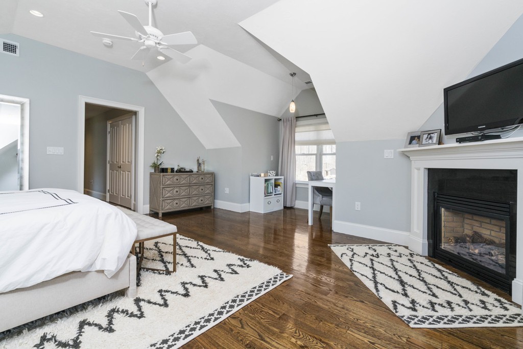 38 Smith Place Cohasset, MA 02025 - Photo 14 of 28 a spacious bedroom with a bed and a flat screen tv