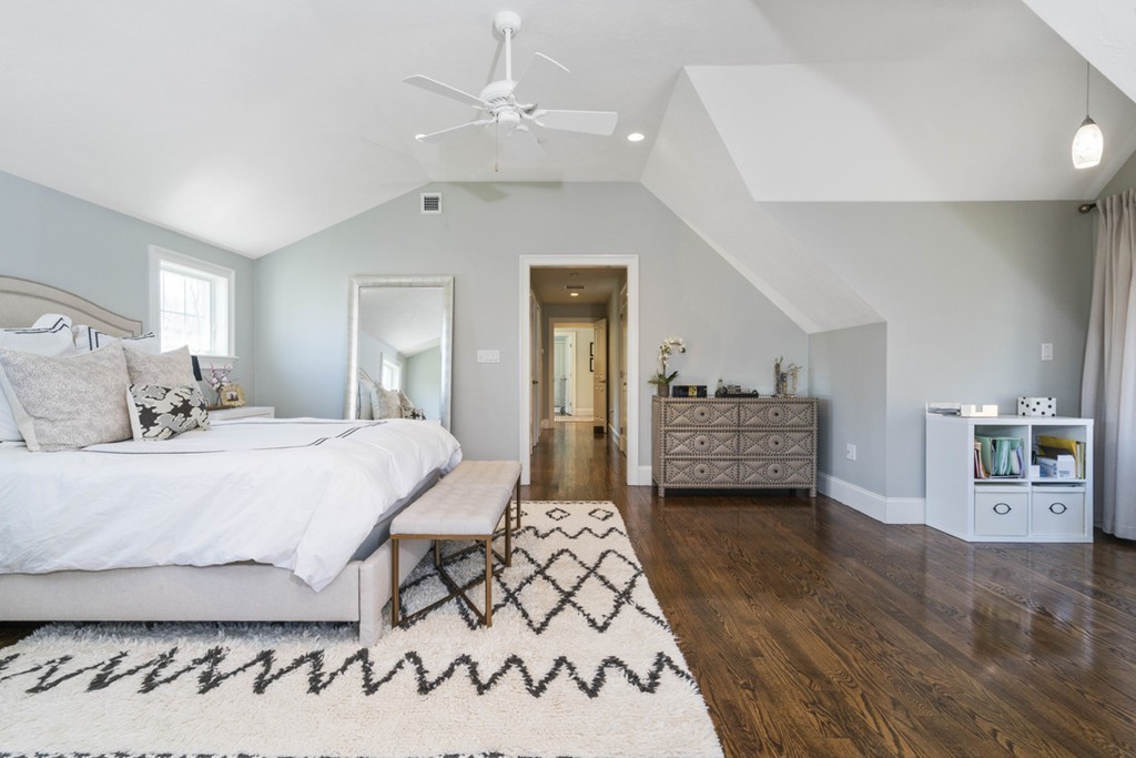 38 Smith Place Cohasset, MA 02025 - Photo 15 of 28 a bedroom with a large bed and a walk in closet