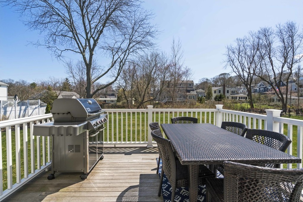 38 Smith Place Cohasset, MA 02025 - Photo 22 of 28 a view of a deck with two chairs and a table