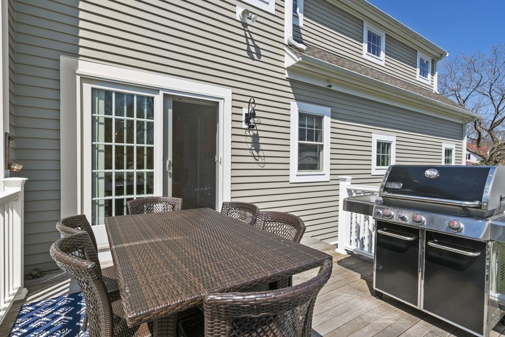 38 Smith Place Cohasset, MA 02025 - Photo 23 of 28 a backyard of a house with seating space