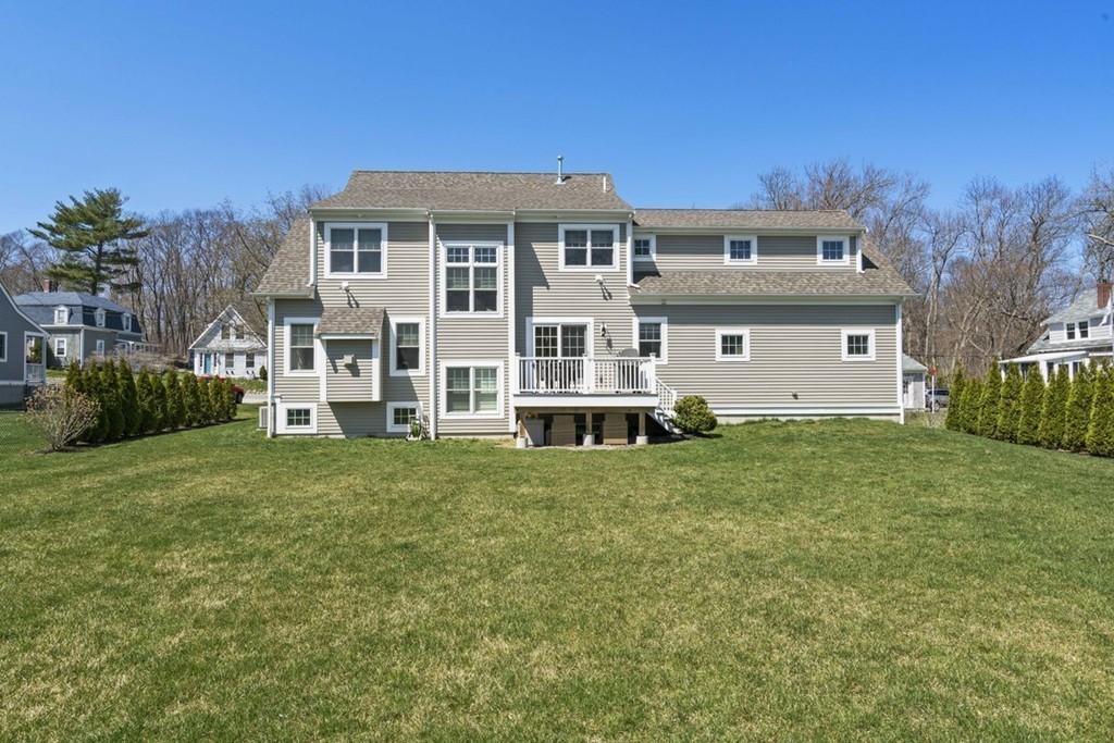 38 Smith Place Cohasset, MA 02025 - Photo 24 of 28 a front view of a house with a garden