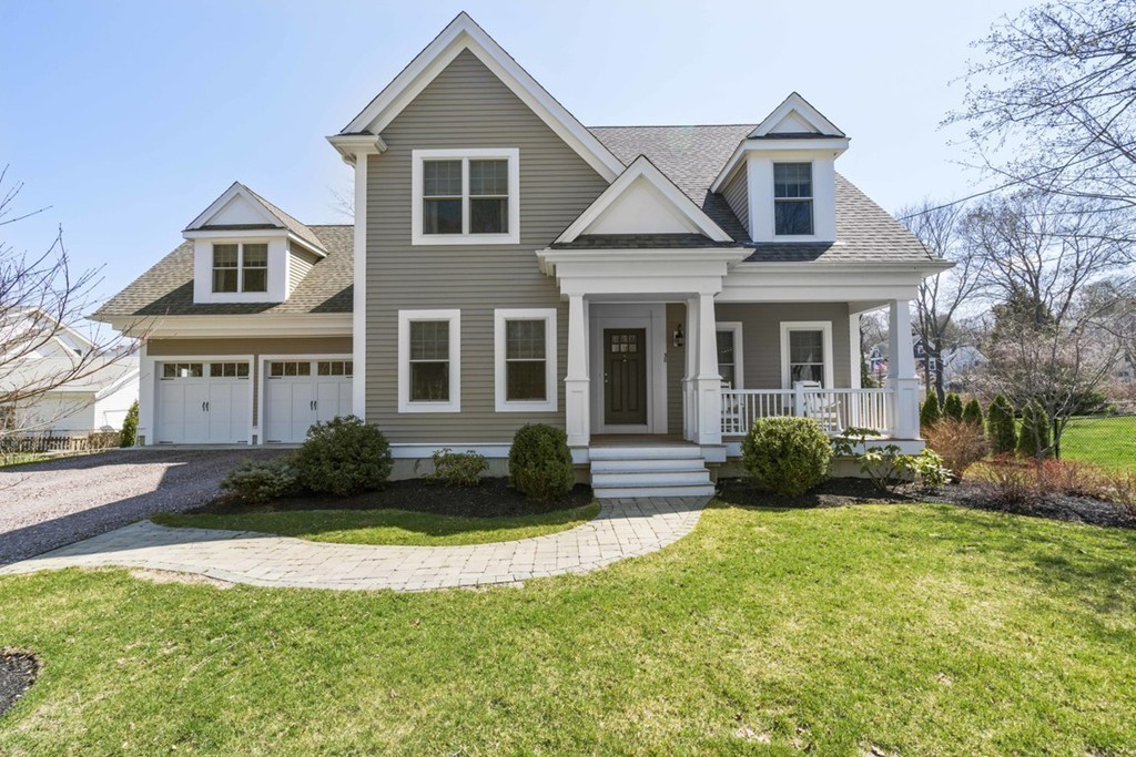 38 Smith Place Cohasset, MA 02025 - Photo 26 of 28 a front view of a house with a yard and outdoor seating