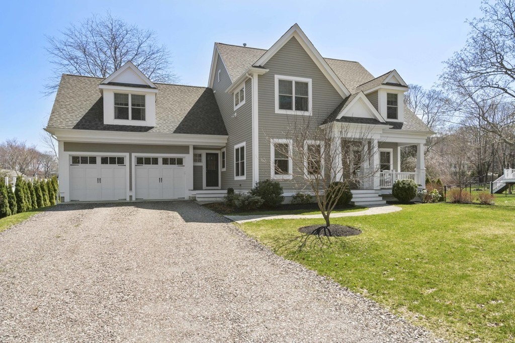 38 Smith Place Cohasset, MA 02025 - Photo 27 of 28 a front view of a house with a yard