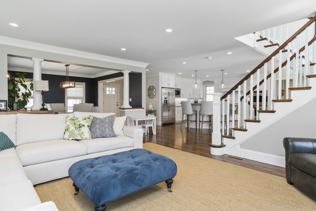 38 Smith Place Cohasset, MA 02025 - Photo 7 of 28 a living room with lots of furniture and a dining table with wooden floor