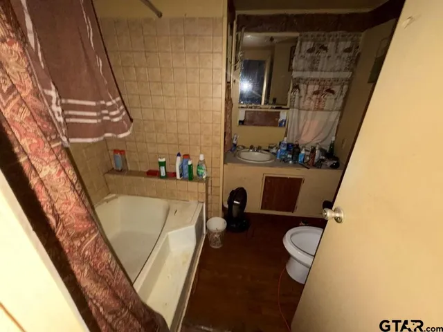 a bathroom with sink and mirror