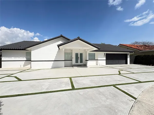 a front view of a house with a garage