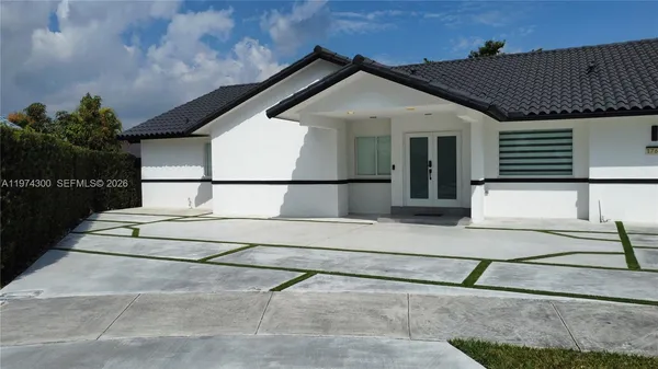 a view of a house with a street
