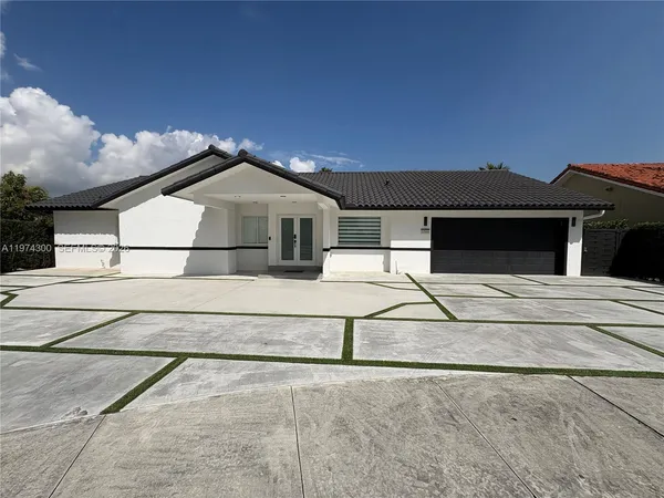 a aerial view of a house with a yard