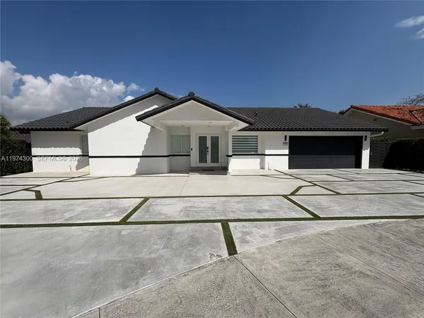 a kitchen with a sink and a stove top oven