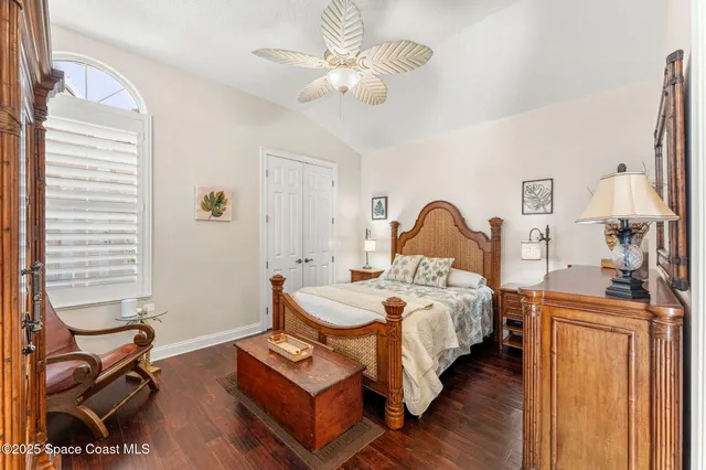 a living room with furniture a fireplace and large windows