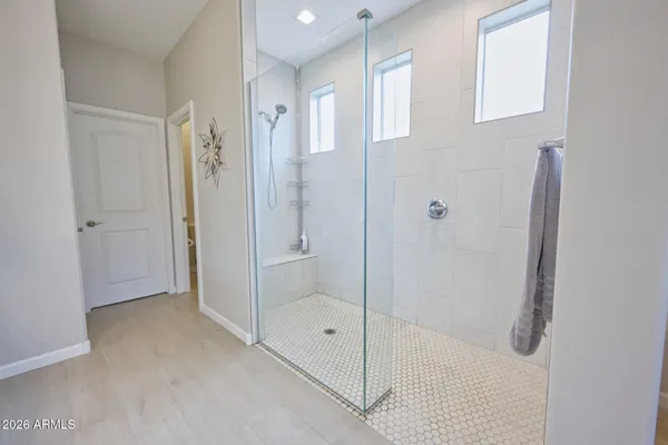 a spacious bathroom with a double vanity sink mirror and double