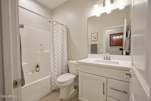 a view of a bathroom from a hallway