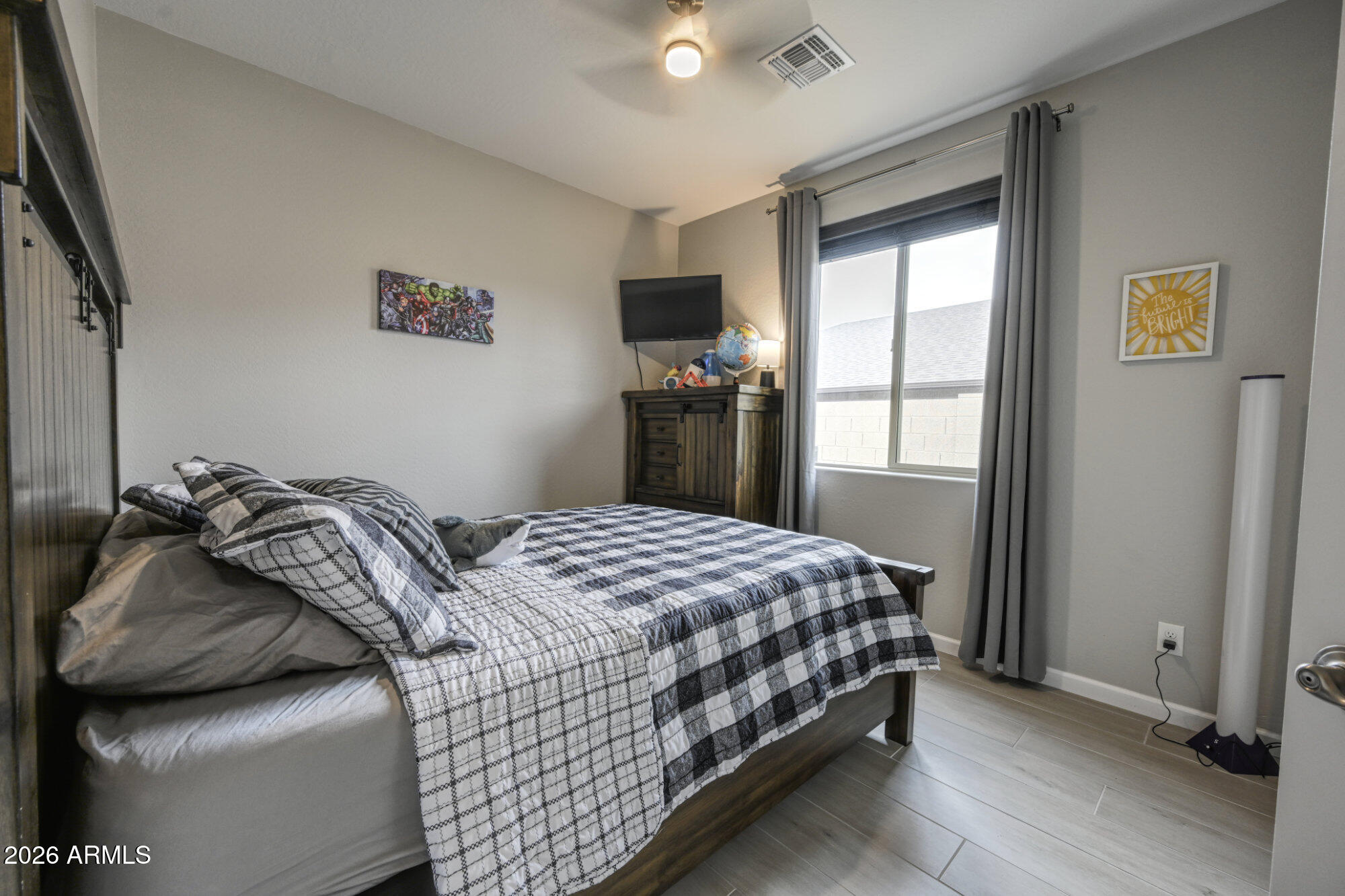 576 Whistle Stop Road Clarkdale, AZ 86324 - Photo 20 of 28 a bedroom with a bed and a flat screen tv
