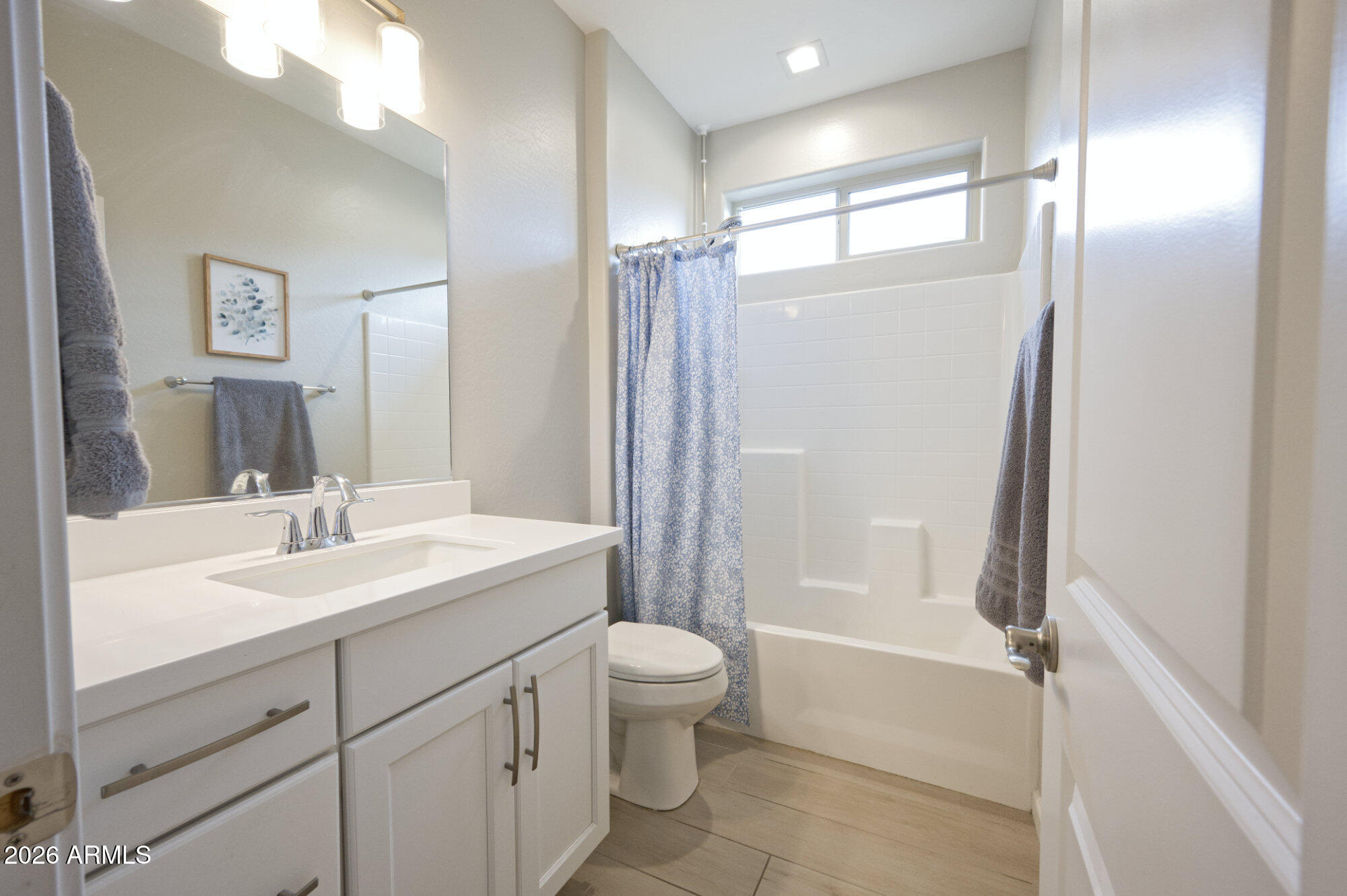 576 Whistle Stop Road Clarkdale, AZ 86324 - Photo 21 of 28 a bathroom with a sink a toilet and shower