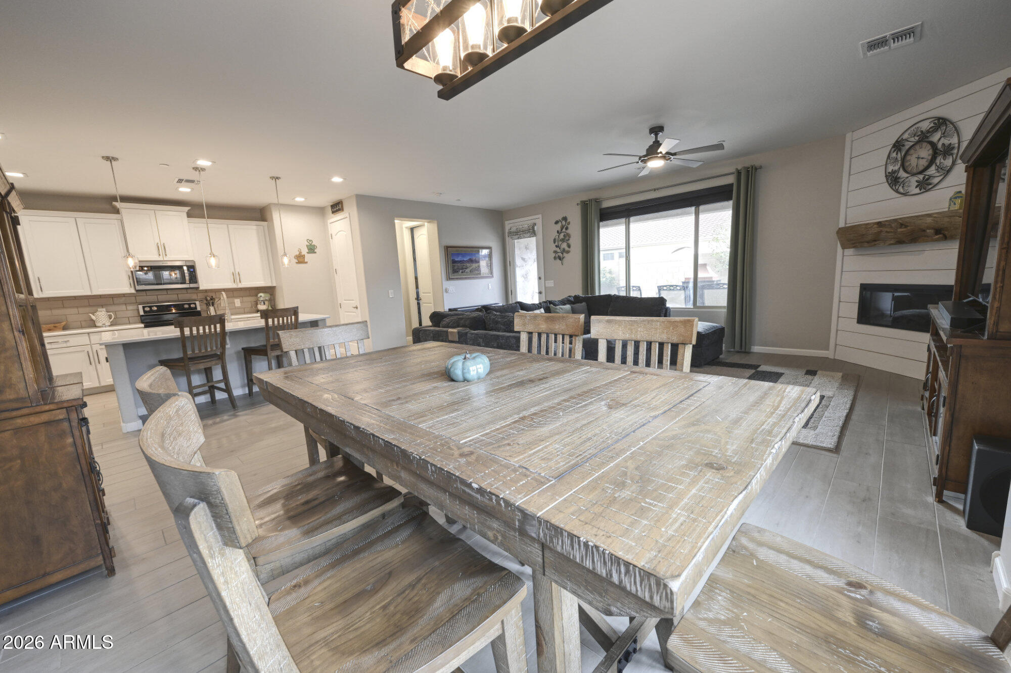 576 Whistle Stop Road Clarkdale, AZ 86324 - Photo 7 of 28 a dinning room with kitchen island furniture a stove a sink and a large window