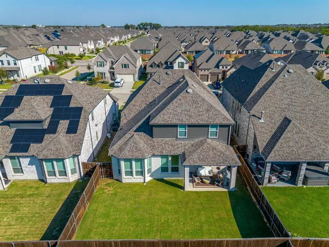 a aerial view of a house with swimming pool yard and balcony