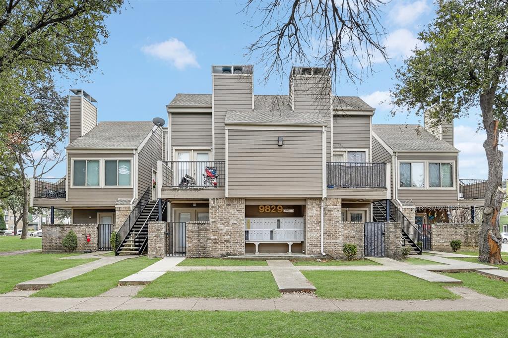 9829 Walnut Street, Unit 308 Dallas, TX 75243 - Photo 1 of 24 a view of a building with a yard