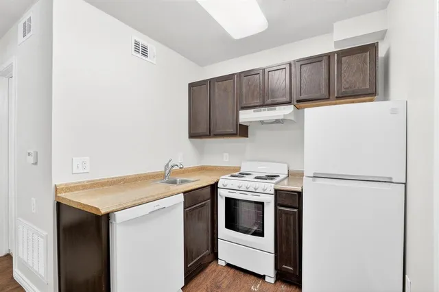a utility room with sink washer and dryer