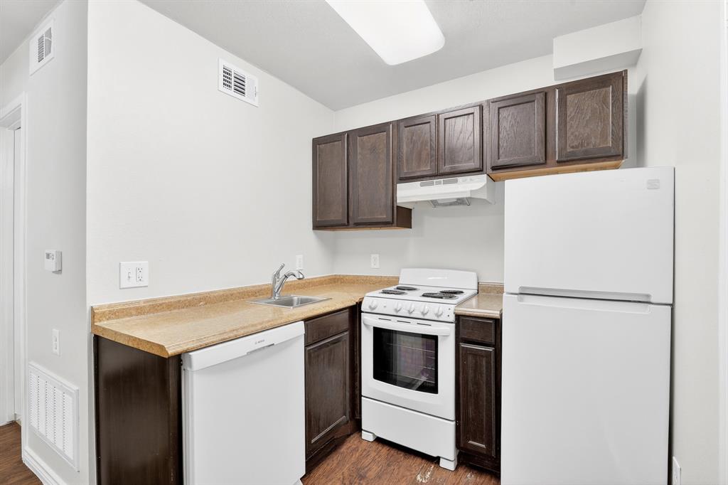 9829 Walnut Street, Unit 308 Dallas, TX 75243 - Photo 14 of 24 a utility room with sink washer and dryer