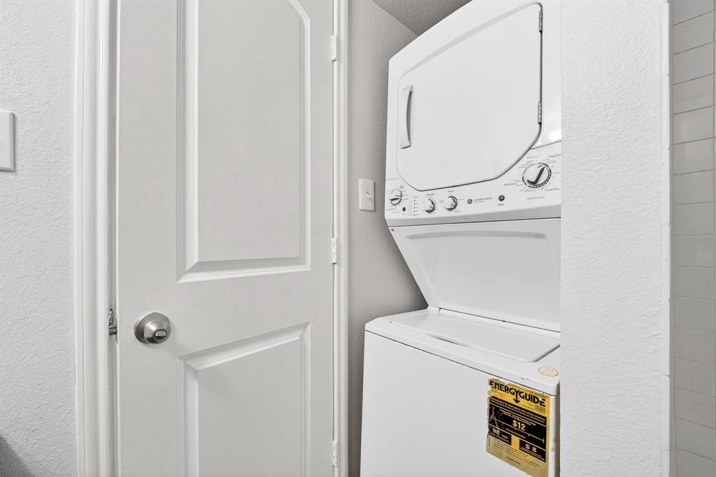 9829 Walnut Street, Unit 308 Dallas, TX 75243 - Photo 23 of 24 a utility room with dryer and washer