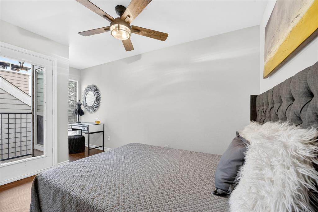 9829 Walnut Street, Unit 308 Dallas, TX 75243 - Photo 24 of 24 a bedroom with a bed and a chandelier