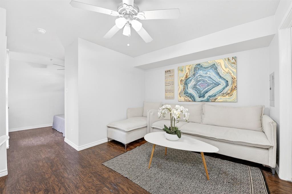 9829 Walnut Street, Unit 308 Dallas, TX 75243 - Photo 5 of 24 a living room with furniture and a painting on the wall