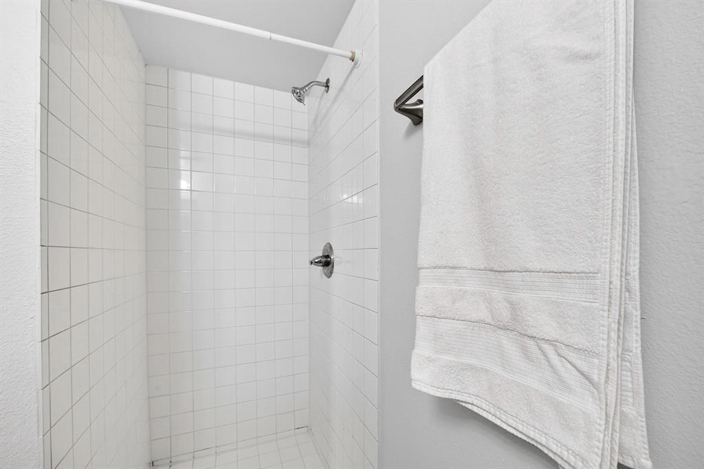 9829 Walnut Street, Unit 308 Dallas, TX 75243 - Photo 8 of 24 a bathroom with a shower