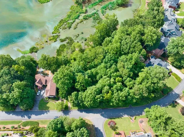 an aerial view of residential house with outdoor space and swimming pool