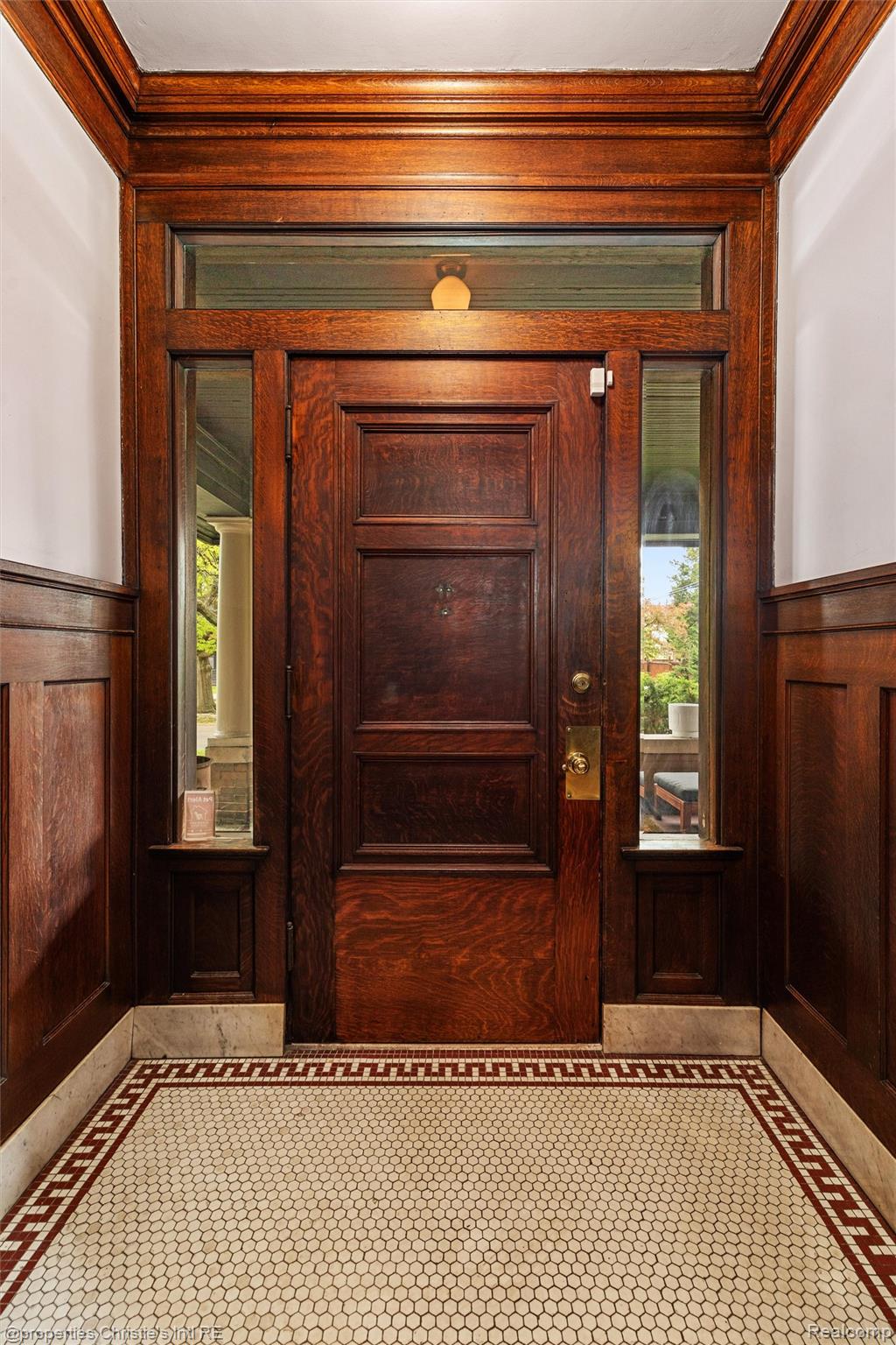 36 Longfellow Street Detroit, MI 48202 - Photo 8 of 81 Detailed view of wainscoting, wooden walls, a decorative wall, and ornamental molding