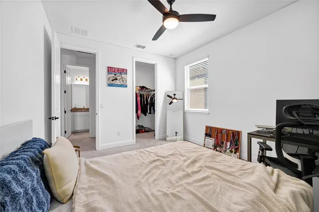 a bedroom with a bed and a dresser