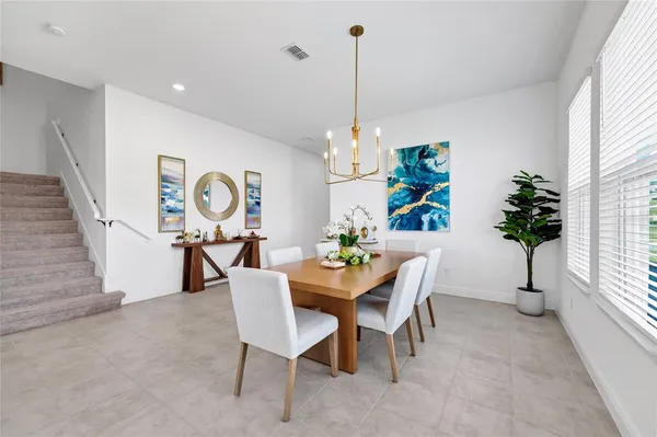 a view of a dining room with furniture window and entryway