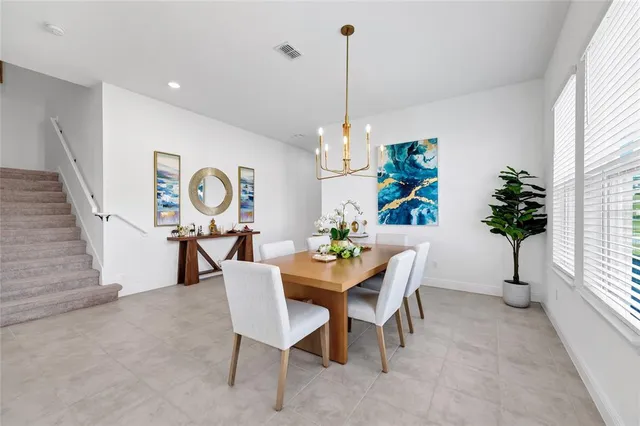 a view of a dining room with furniture window and entryway