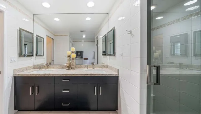 a view of a bathroom from a hallway