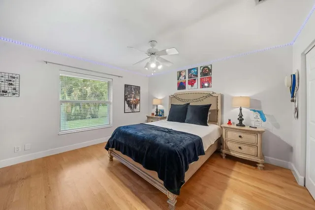 a spacious bathroom with a granite countertop sink mirror and toilet