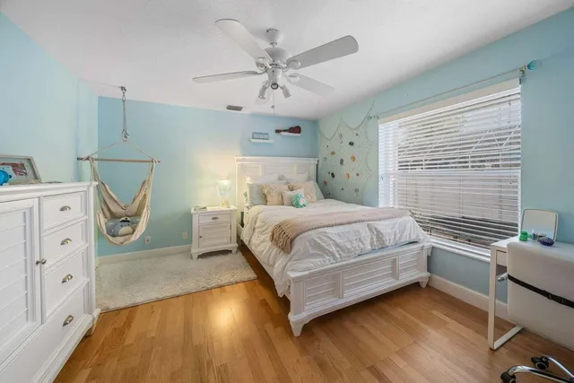 a bedroom with furniture and a book shelf