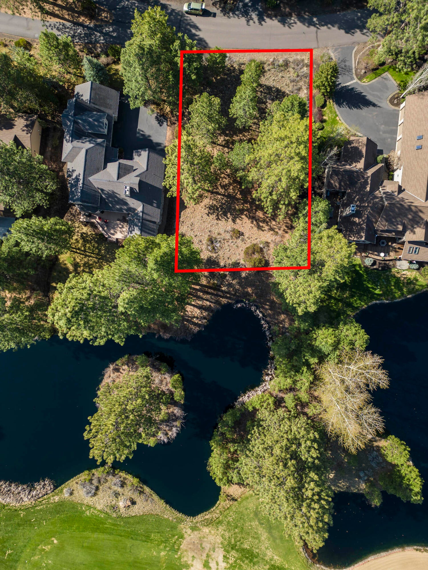 60711 Golf Village Loop Bend, OR 97702 - Photo 25 of 31 Location of lot along the pond behind the lot