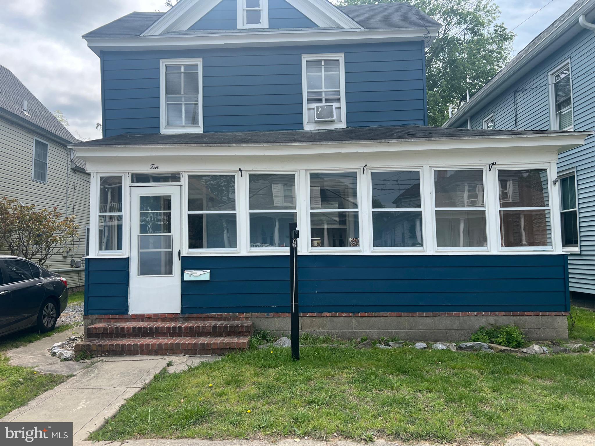 10 Willis Street Cambridge, MD 21613 - Photo 1 of 27 Charming blue home with inviting porch.