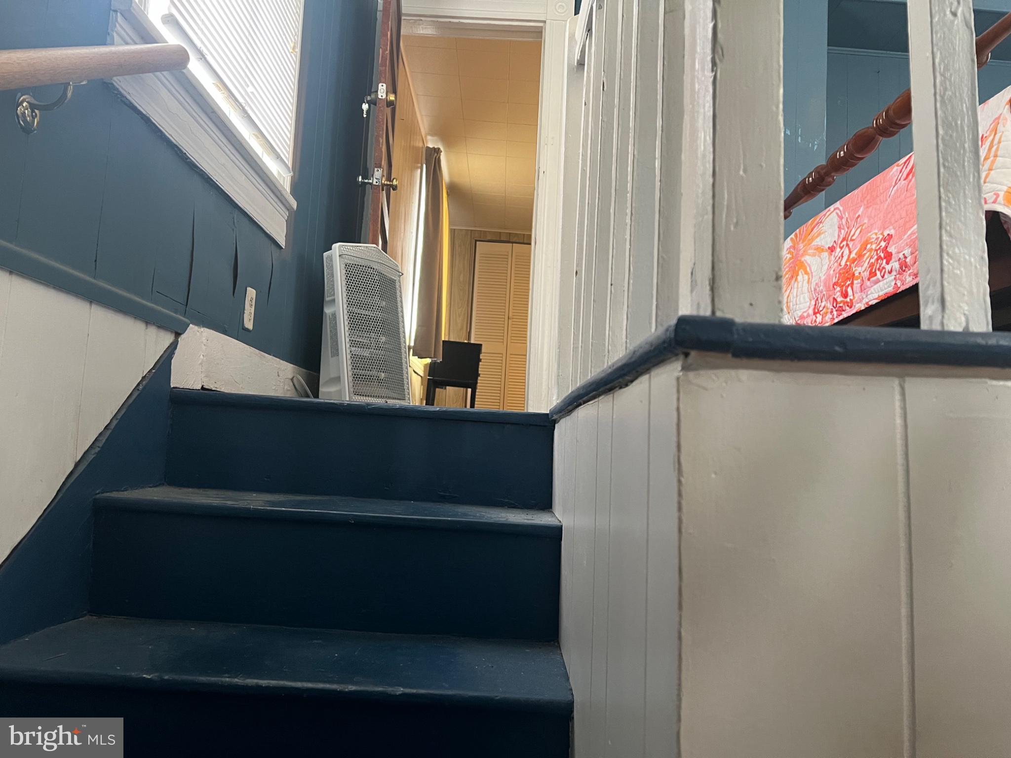 10 Willis Street Cambridge, MD 21613 - Photo 13 of 27 Charming staircase to cozy spaces.