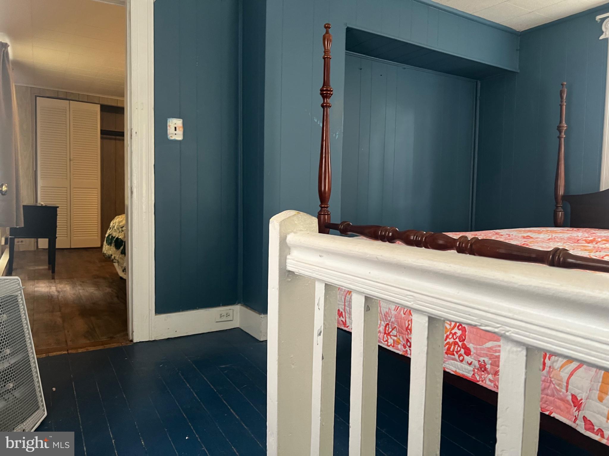 10 Willis Street Cambridge, MD 21613 - Photo 14 of 27 Charming bedroom with rich blue walls.