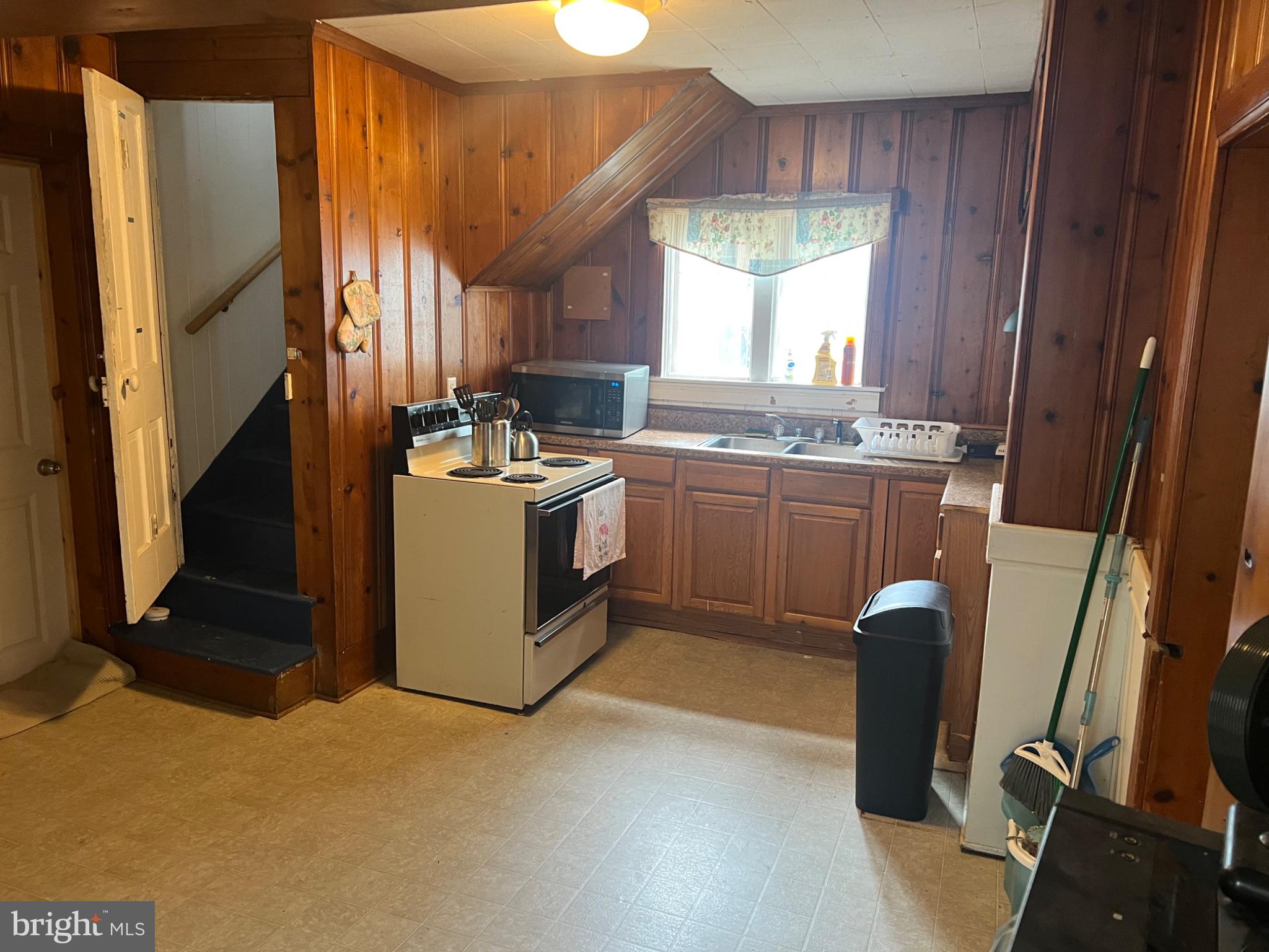 10 Willis Street Cambridge, MD 21613 - Photo 9 of 27 Cozy kitchen with warm wooden accents.