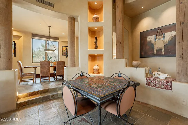 a kitchen with stainless steel appliances granite countertop a sink and a refrigerator