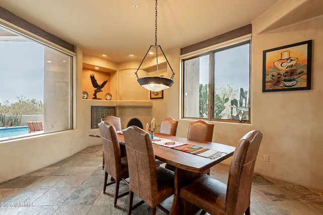 a kitchen with granite countertop a sink a counter top space appliances and cabinets